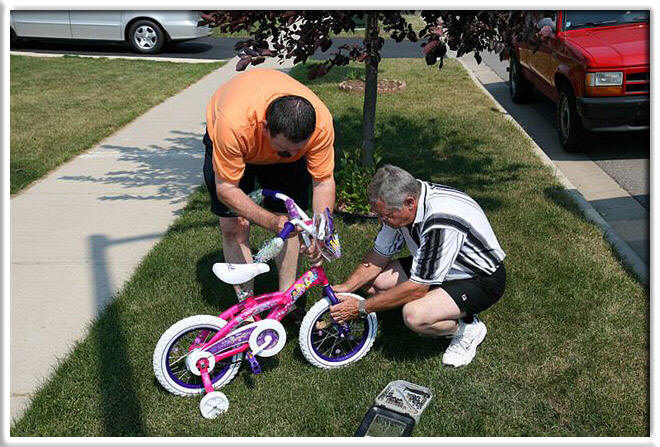 Poppa T & Poppa R get the bike all ready for her
