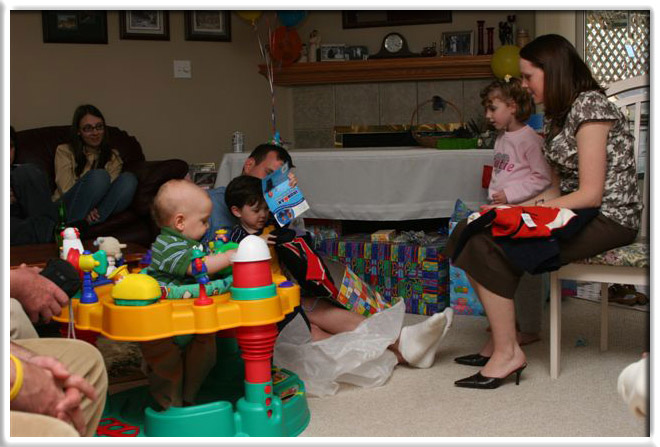Will's getting lots of help opening his gifts